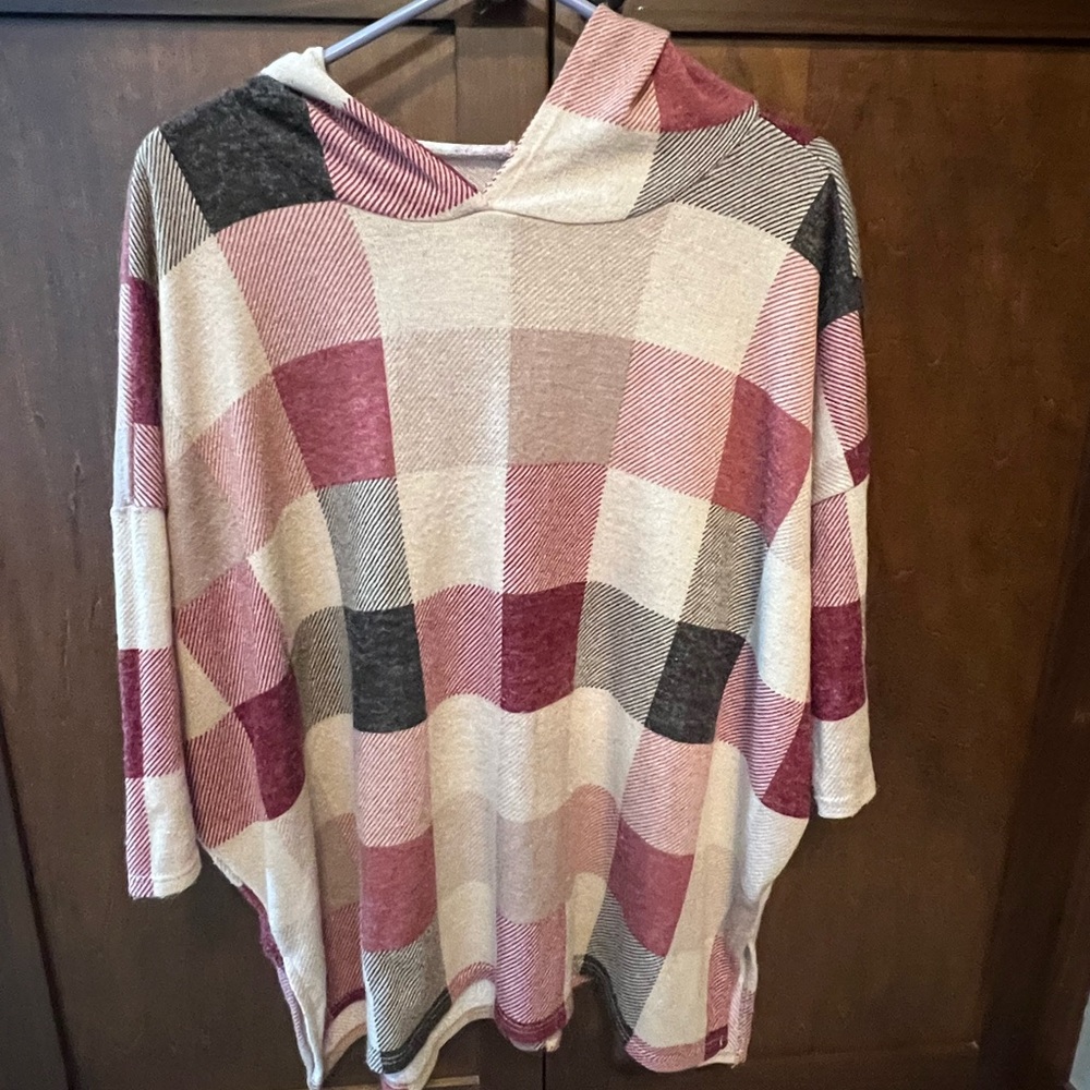Multi colored poncho with hood.